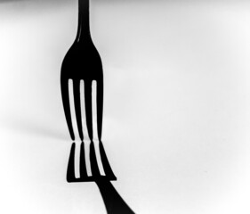 fork with shadow on a white background	