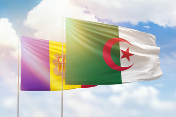 Sunny blue sky and flags of algeria and andorra