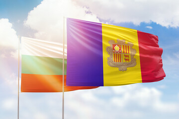 Sunny blue sky and flags of algeria and bulgaria