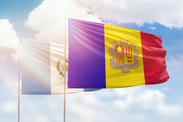 Sunny blue sky and flags of algeria and guatemala