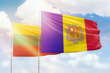 Sunny blue sky and flags of algeria and lithuania