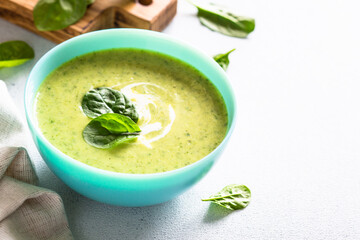 Green soup. Spinach cream soup with cream. Healthy vegan dish. Close up.