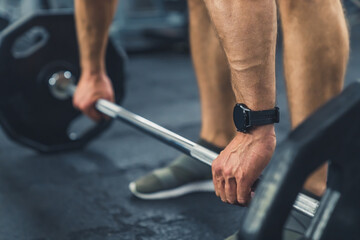 strong athlete man person exercising in the sport gym, workout exercise training in fitness for body strong and fit, bodybuilding and healthy lifestyle people. High quality photo