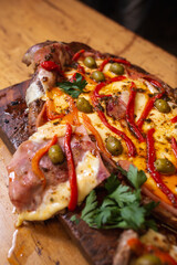 matambre a la pizza with grilled olives ready to be served