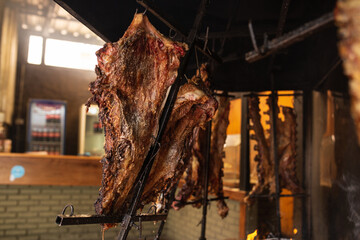 Argentine beef ribs slowly cooking to the flames