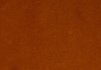 Full frame image of textured dark orange velvet with copy space