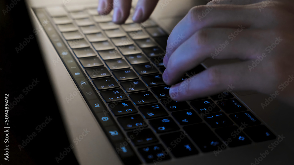 Poster close-up of man's hands typing on the keyboard. concept. men's hands type text on the keyboard at ni