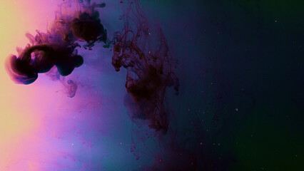 Drops of dark ink on colorful background dissolve beautifully in water. Stock footage. Drop of...