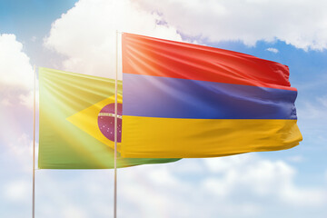 Sunny blue sky and flags of armenia and brazil