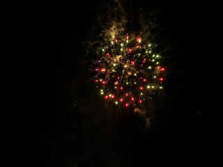 Fireworks display in the port town. low light