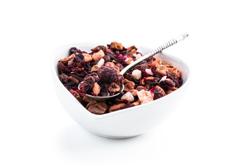 Dry fresh fruit tea in small ceramic bowl isolated on white
