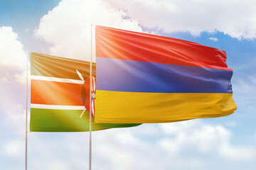 Sunny blue sky and flags of armenia and kenya