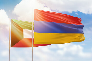 Sunny blue sky and flags of armenia and kuwait