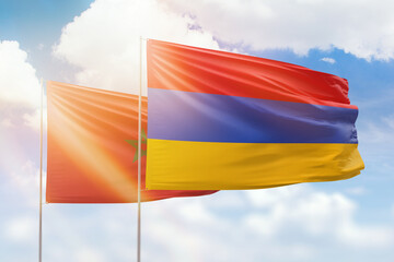 Sunny blue sky and flags of armenia and morocco