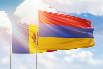 Sunny blue sky and flags of armenia and moldova