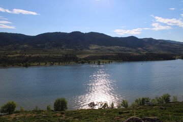 lake in the mountains with sun