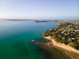 Fototapeta na wymiar Aerial shots of beachfront property in Red Beach, New Zealand