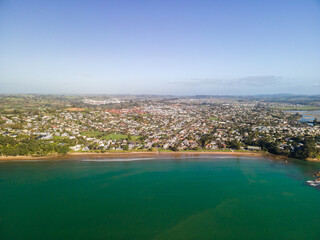 Spectacular beachfront properties seen aerially from the sky by drone in Red beach, New Zealand 