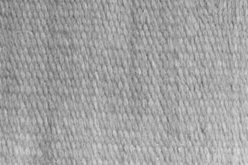 White grey wool yarn cloth background. Surface of fabric texture in white winter color.