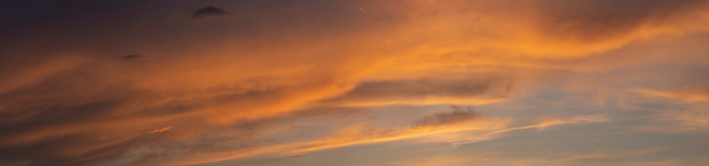 Leaden, storm clouds covered the sunset. Cumuliform cloudscape on blue sky. Tragic gloomy sky.