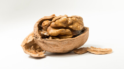 Walnuts are rounded, single-seeded stone fruits of the walnut tree. Cracking a nut.