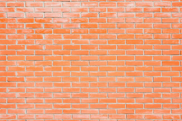 Red brick wall background outside of the building.