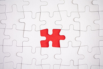 missing piece of jigsaw puzzle with red background
