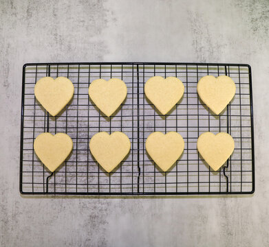 Heart shaped sugar cookies to be decorated with royal icing for valentine's day.