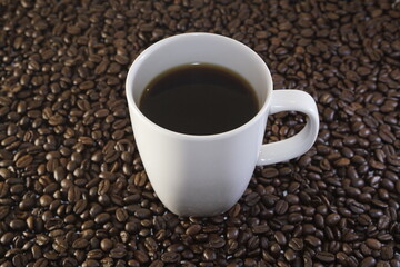 Cup of coffee and coffee beans, caffeine