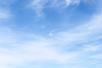 Naklejka na ściany i meble Vast blue sky with light clouds on background