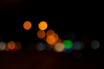 bokeh background of the lights in the night city and street lamps out of  focus