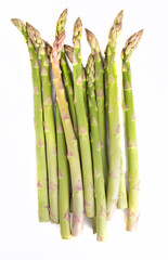 Asparagus on a white background. Green seasonal vegetables, isolated. Packshot photo.