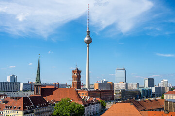 The famous TV Tower of Berlin with the town hall on a sunny day