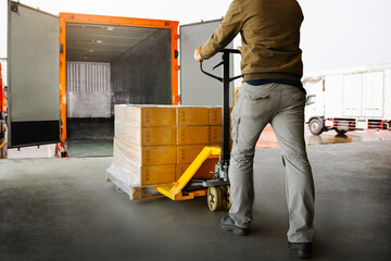 Workers Unloading Packaging Boxes on Pallets into The Cargo Container Trucks. Loading Dock. Shipping Warehouse. Delivery. Shipment Goods. Supply Chain. Warehouse Logistics Cargo Transport.	
