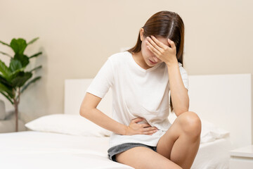 Flatulence ulcer, asian young woman, girl hands in belly, stomachache from food poisoning,...