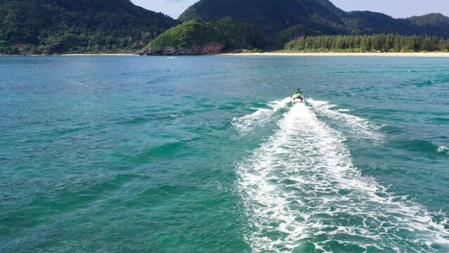 AH - Jetski in Tropical Ocean and Beautiful Island