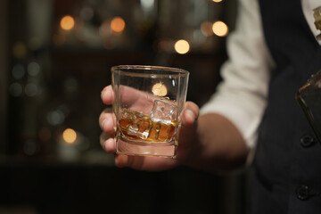 Barman pouring whiskey whiskey glass beautiful night