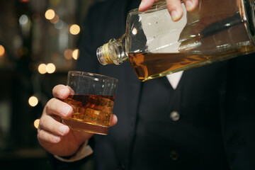 Barman pouring whiskey whiskey glass beautiful night