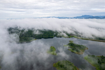 beautiful lake above the dam among blue sky clouds and mountains,lake mountain view