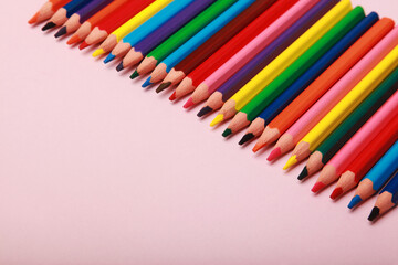 close up photo of a collection of colourful wooden pencil, art supplies. isolated on  studio background with copy space.