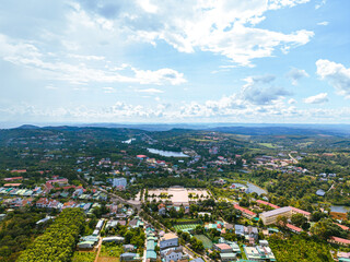 Aerial view of National Route 14 in Kien Duc town, Dac Nong province, Vietnam with hilly landscape and sparse population around the roads.