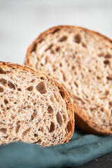 The process of making wheat bread at home. A slice of homemade sourdough bread. The concept of healthy homemade food. Front view.