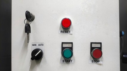 Control panel of the industrial machine in factory with buttons and lamp