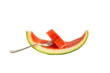 Fototapeta na wymiar A slice of watermelon with fork,in the peel,isolated on white surface with copy space