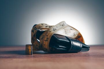 wallet and measuring tape on the table