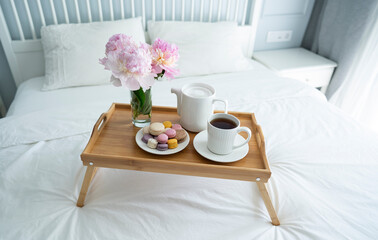 Fototapeta na wymiar Tray with breakfast on bed.