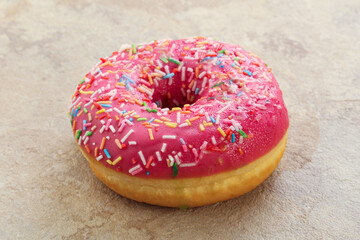 Sweet glazed struwberry donut with icing