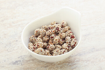 Sweet peanut in sesame seeds