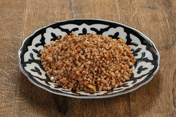 Boiled buckwheat porrige in the plate
