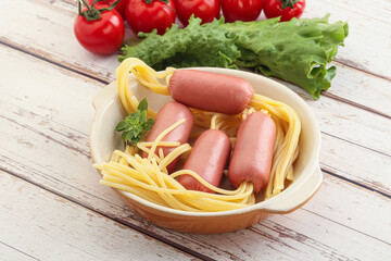 Mini sausages with pasta spaghetti